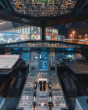 Airbus A320 Cockpit Interior at Night with Illuminated Flight Deck Panels HD phone wallpaper
