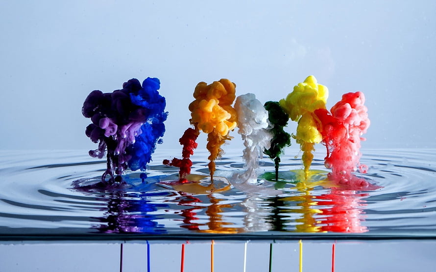 Vibrant Paint Drops Creating Colorful Ink Clouds in Water HD wallpaper