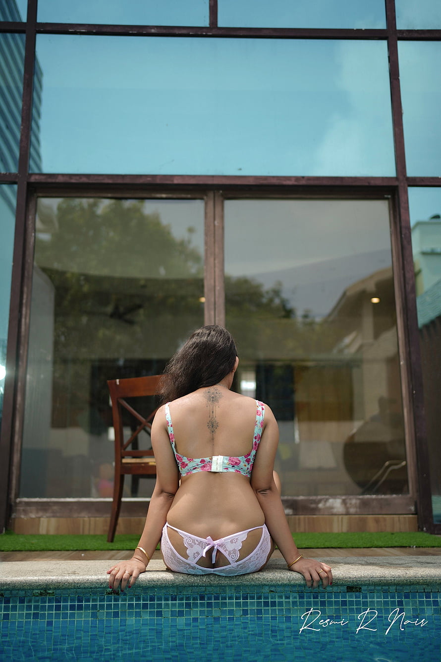 Resmi R Nair Sitting on Pool Edge in Floral Bikini with Back Tattoo HD phone wallpaper