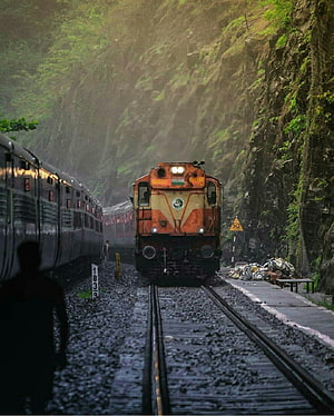 Indian Railways Locomotive Navigating a Misty Mountain Pass with Dense Green Foliage HD phone wallpaper