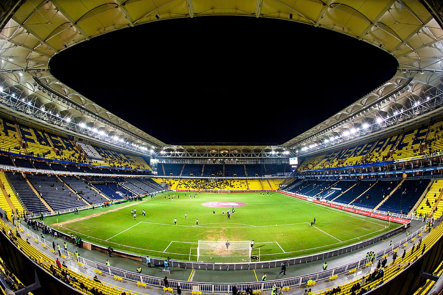 Fenerbahce Stadium Interior with Yellow and Blue Seating at Night HD wallpaper
