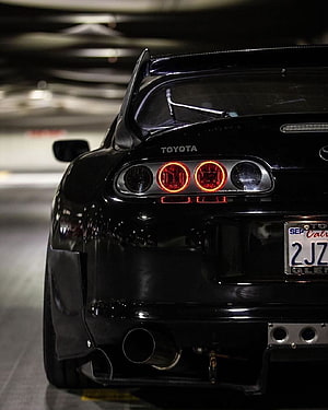 Rear View of a Black Toyota Supra A80 MkIV with Custom Taillights and Carbon Fiber Spoiler HD phone wallpaper