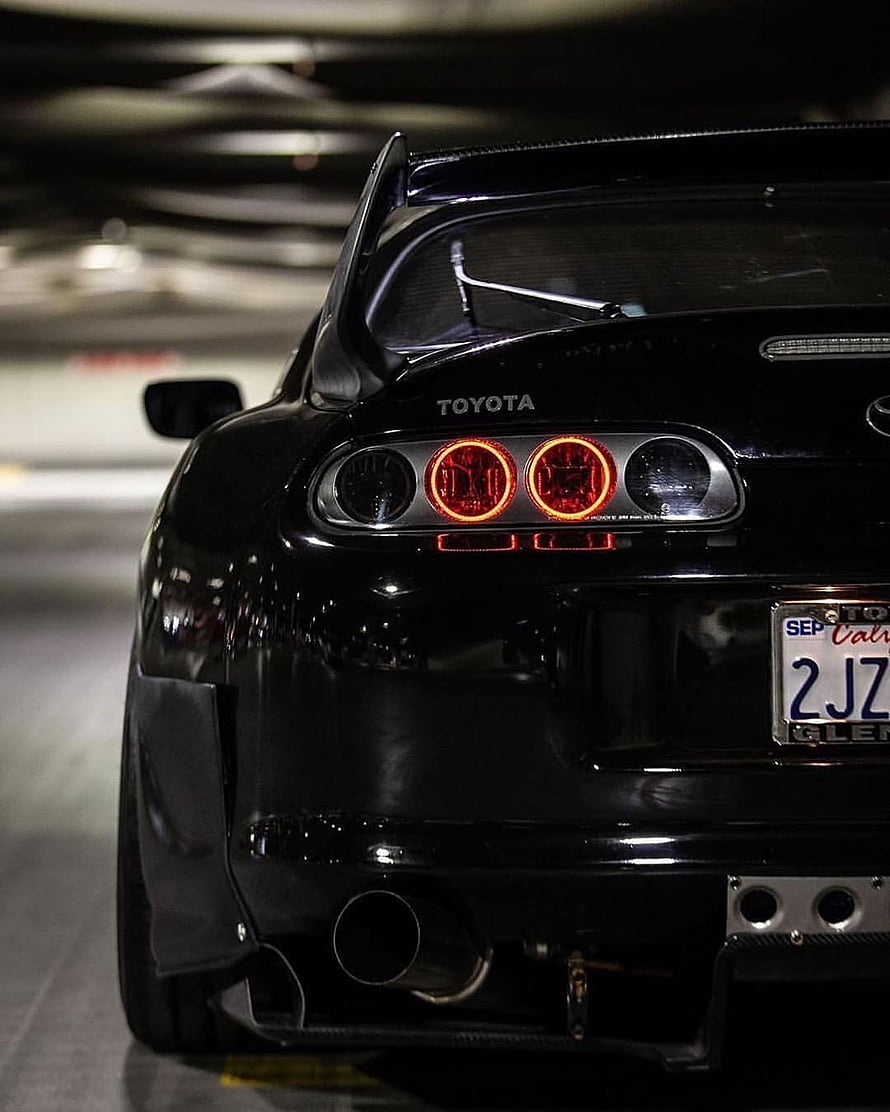 Rear View of a Black Toyota Supra A80 MkIV with Custom Taillights and Carbon Fiber Spoiler HD phone wallpaper