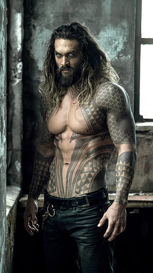 Jason Momoa as Aquaman with Tribal Tattoos in Dark Industrial Setting HD phone wallpaper