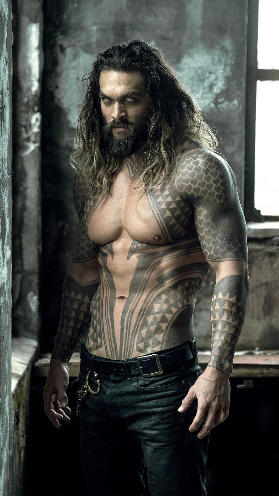 Jason Momoa as Aquaman with Tribal Tattoos in Dark Industrial Setting HD phone wallpaper