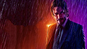 John Wick in the Rain with Neon Lighting and Dramatic Shadow HD wallpaper