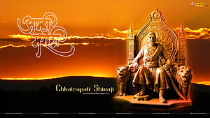 Chhatrapati Shivaji Maharaj Statue Seated on Royal Throne with Lions at Sunset HD wallpaper
