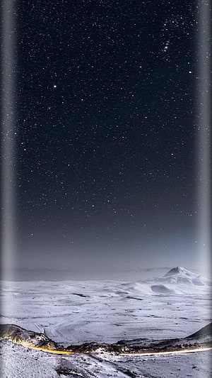 Starry Night Sky Over Snowy Mountain Landscape with Curved Screen Effect HD phone wallpaper