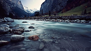 Alpine River Valley with Snow-Capped Peaks and Misty Water Flow HD wallpaper
