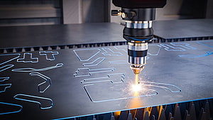 Industrial CNC Laser Cutting Machine Processing Metal Sheet with Bright Sparks HD wallpaper
