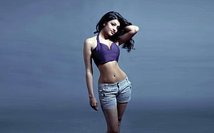 Kajal Agarwal Studio Portrait in Purple Halter Top and Denim Shorts HD wallpaper