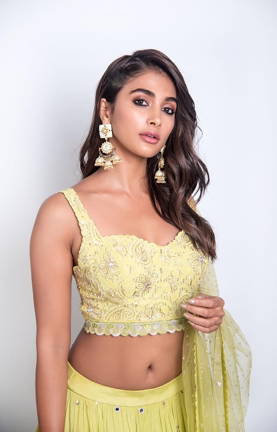 Pooja Hegde in Yellow Embroidered Choli and Pleated Skirt with Gold Jhumka Earrings HD phone wallpaper