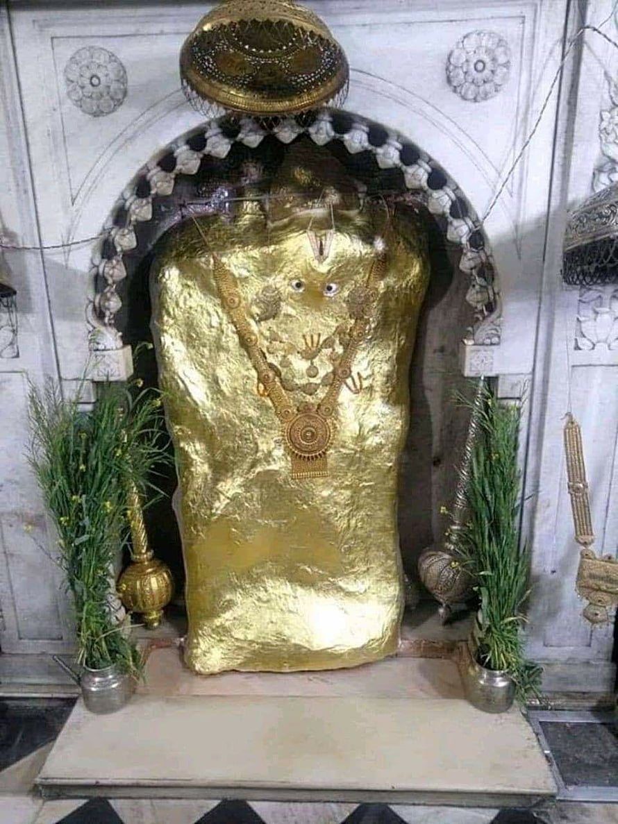 Mehandipur Balaji Temple Shrine with Golden Idol and Sacred Offerings HD phone wallpaper