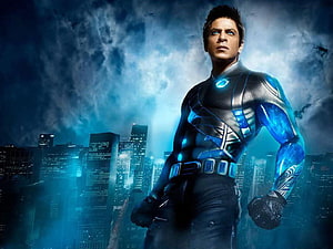 Shah Rukh Khan as Ra One in Futuristic Blue Suit Against Nighttime City Skyline HD wallpaper
