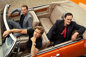 Brad Pitt, Leonardo DiCaprio, and Quentin Tarantino in a vintage orange convertible for Once Upon a Time in Hollywood HD wallpaper