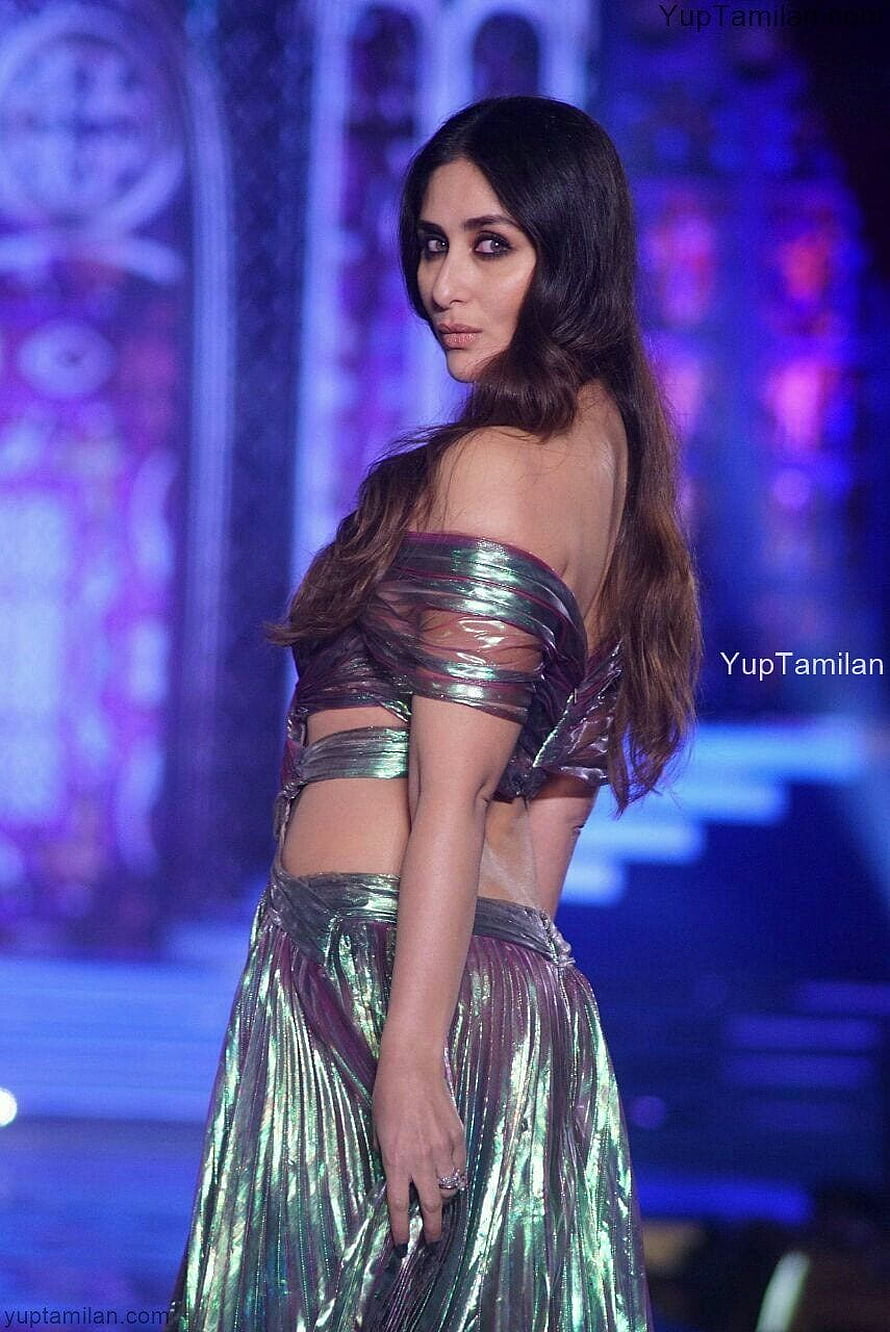 Kareena Kapoor Khan in a shimmering metallic green off-shoulder gown on a fashion runway HD phone wallpaper