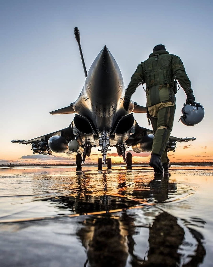 Fighter Pilot Walking Toward Indian Air Force Jet on Wet Runway at Sunset HD phone wallpaper
