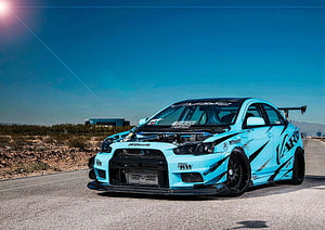 Light Blue Modified Mitsubishi Lancer Evolution X Widebody on Desert Track HD wallpaper