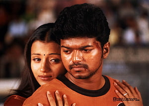 Vijay and Trisha in an emotional embrace from the Tamil film Ghilli HD wallpaper