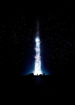 Milky Way Galaxy Rising Over Silhouetted Horizon With Distant Figures HD phone wallpaper