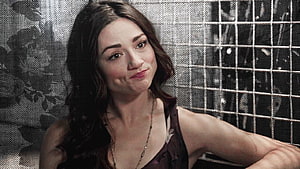 Crystal Reed as Allison Argent in Teen Wolf with a playful expression against a textured backdrop HD wallpaper