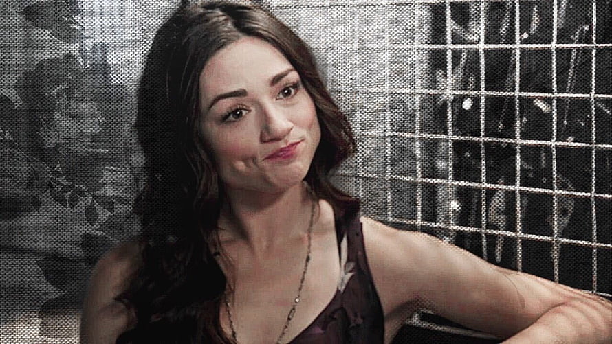 Crystal Reed as Allison Argent in Teen Wolf with a playful expression against a textured backdrop HD wallpaper