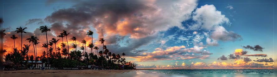 Tropical Beach Sunset with Silhouetted Palm Trees and Dramatic Clouds HD wallpaper