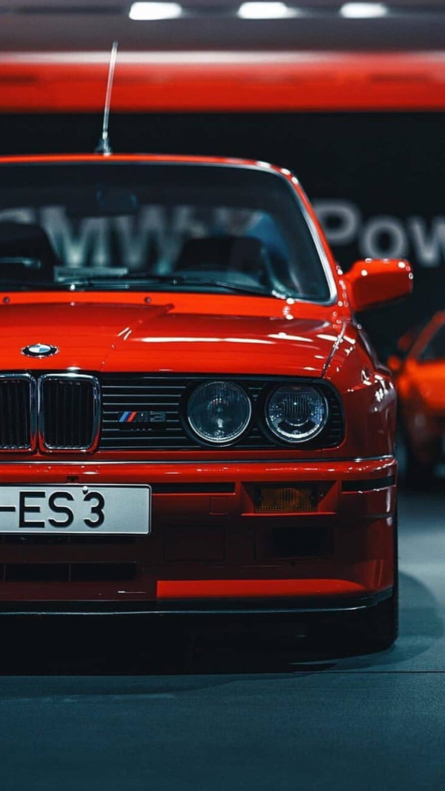 Red BMW E30 M3 Front Grille and Headlights Close-Up at Auto Show HD phone wallpaper