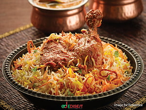Chicken Biryani with Saffron Rice and Crispy Onions in a Traditional Metal Bowl HD wallpaper