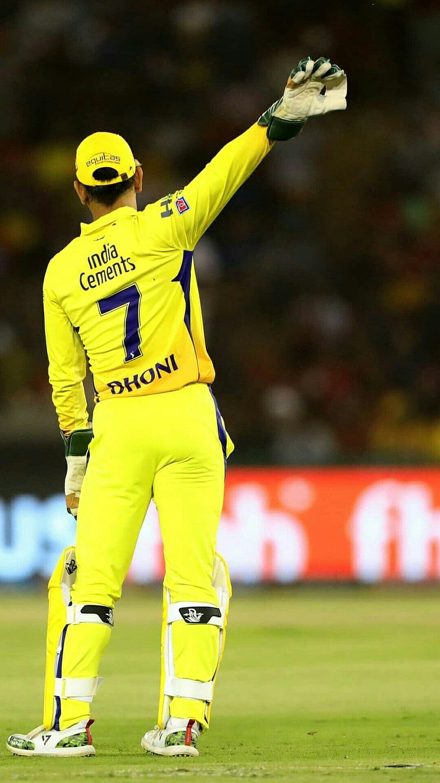 MS Dhoni in India Yellow Jersey Acknowledging Crowd at Cricket Stadium HD phone wallpaper
