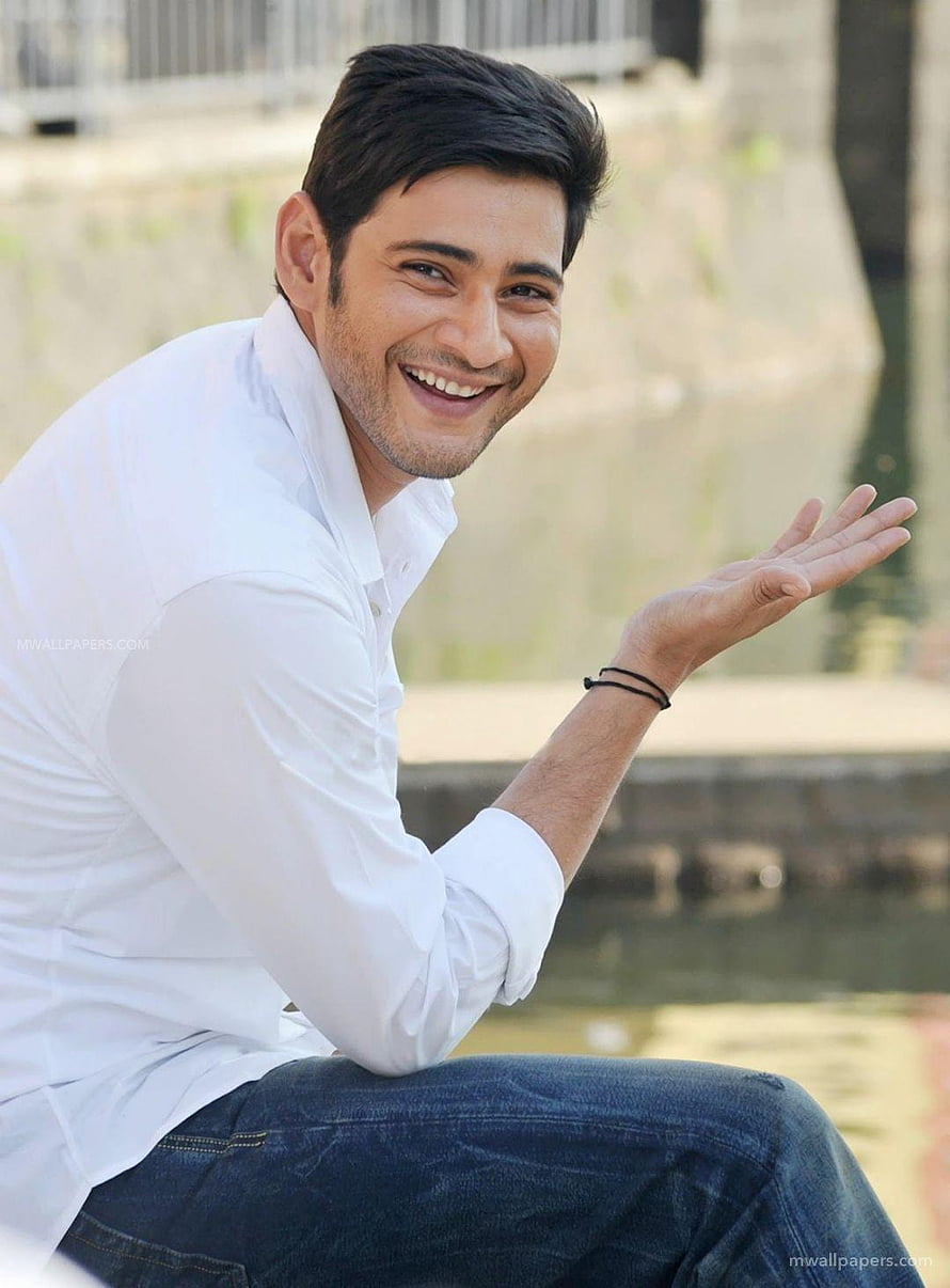 Mahesh Babu Smiling in White Shirt and Jeans by a Water Canal HD phone wallpaper