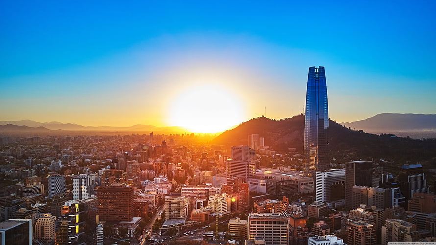 Santiago de Chile skyline at sunset with Andes mountains and modern skyscrapers HD wallpaper
