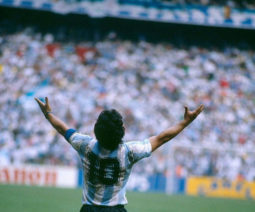 Diego Maradona Celebrating in Argentina National Team Jersey at a Stadium HD wallpaper