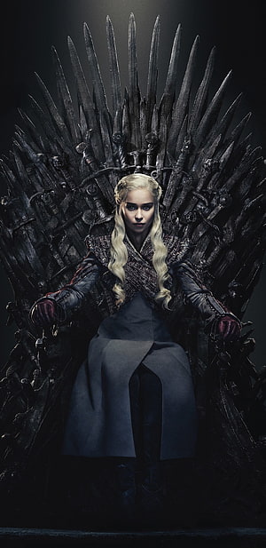 Daenerys Targaryen Seated on the Iron Throne in Dark Fantasy Setting HD phone wallpaper