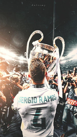 Sergio Ramos lifting the UEFA Champions League trophy in a white Real Madrid jersey HD phone wallpaper