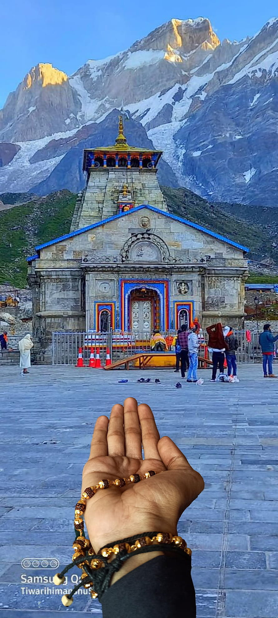 Kedarnath Temple with Praying Hands and Snow-Capped Himalayan Peaks HD phone wallpaper