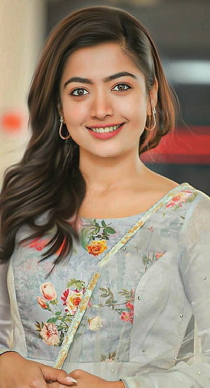 Rashmika Mandanna in a floral embroidered kurta with soft pastel tones and gold trim HD phone wallpaper
