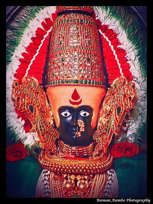 Ornate Kolhapur Mahalaxmi Devi Temple Idol with Gold Crown and Red Floral Garland HD phone wallpaper