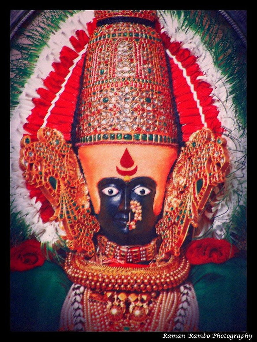 Ornate Kolhapur Mahalaxmi Devi Temple Idol with Gold Crown and Red Floral Garland HD phone wallpaper