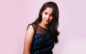 Anikha Surendran Portrait in Black Patterned Dress Against Soft Pink Studio Background HD wallpaper