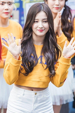Nancy from Momoland Waving in a Yellow Crop Top and White Skirt HD phone wallpaper