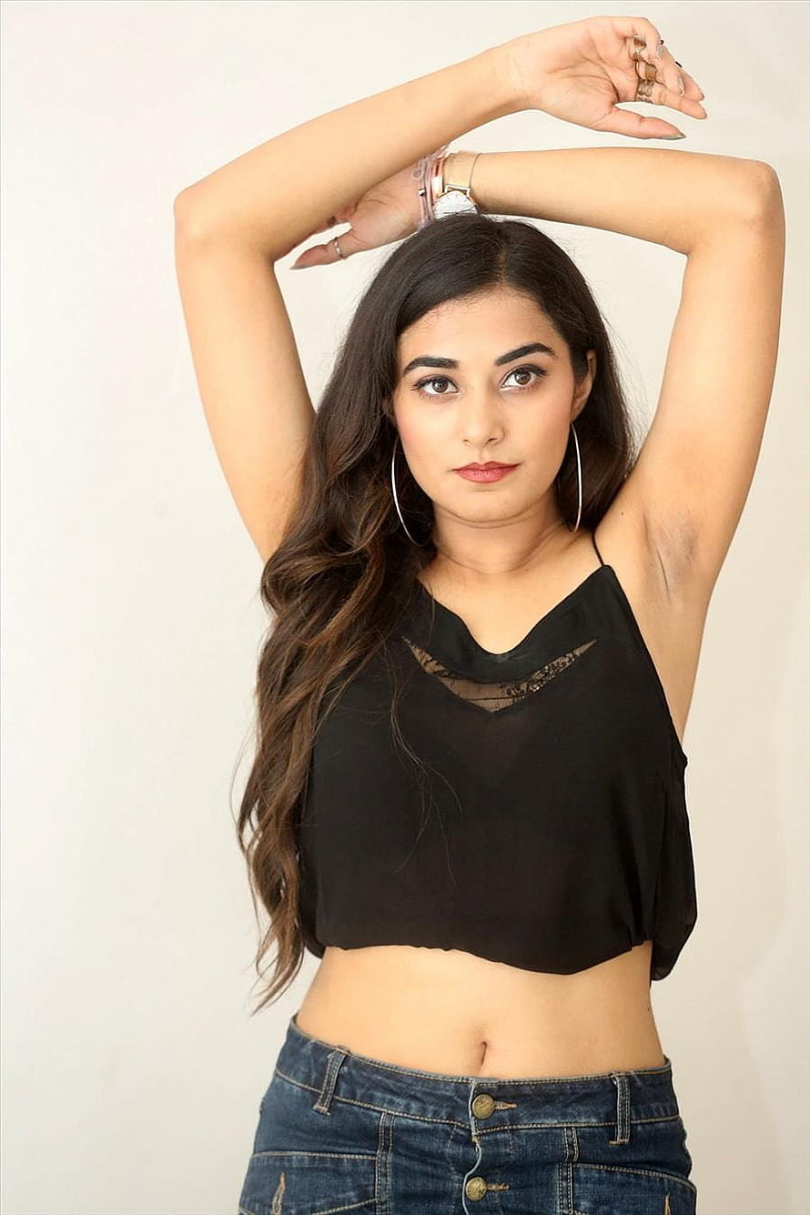 Stefy Patel in Black Crop Top and Denim Jeans with Arms Raised HD phone wallpaper