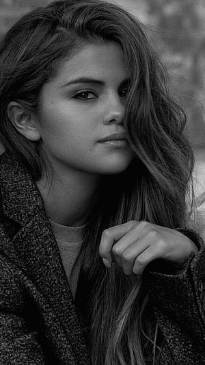Selena Gomez Black and White Portrait in Textured Coat HD phone wallpaper