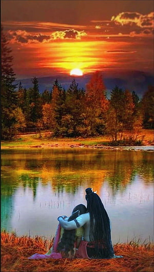 Shiva and Parvati Embracing by a Lake at Sunset HD phone wallpaper