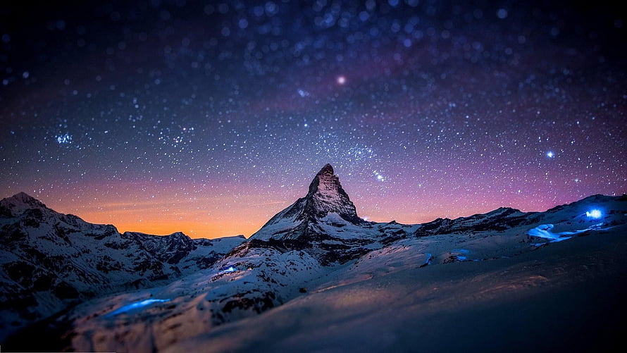 Matterhorn Peak Under a Starry Night Sky with Aurora and Snowy Alpine Landscape HD wallpaper