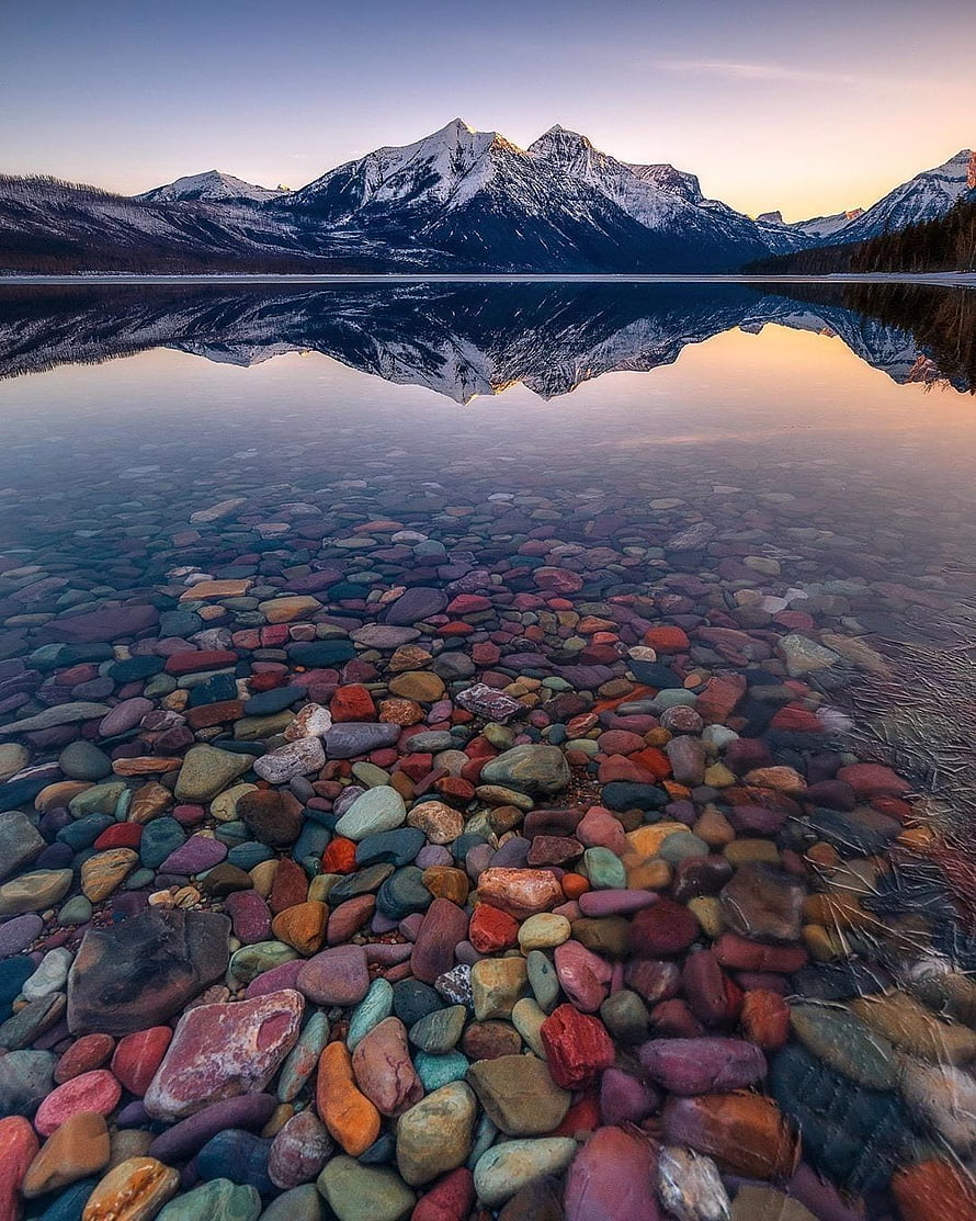 Lake McDonald Reflection at Dawn in Glacier National Park with Colorful Pebbles HD phone wallpaper