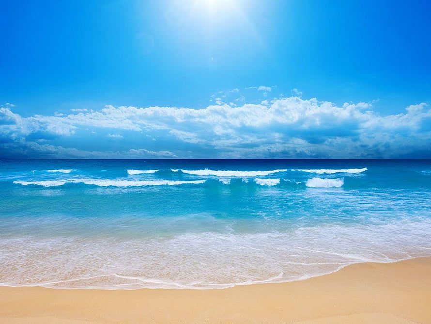 Serene Tropical Beach With Turquoise Waves And Golden Sand Under A Bright Blue Sky HD wallpaper