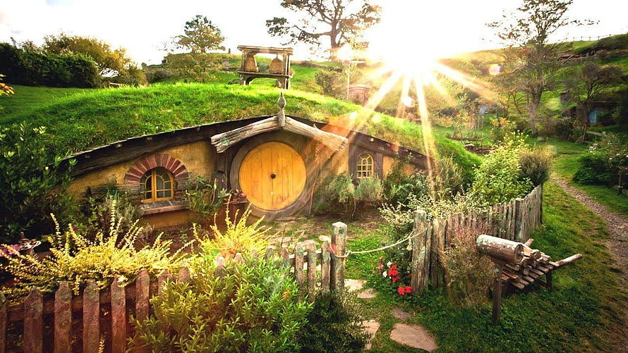 The Shire Hobbiton Hole in the Hill with Round Door and Lush Green Gardens HD wallpaper