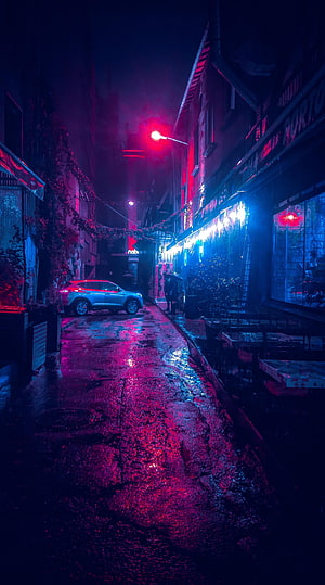 Rainy Neon Alleyway at Night with Cyberpunk Atmosphere and Wet Street Reflections HD phone wallpaper