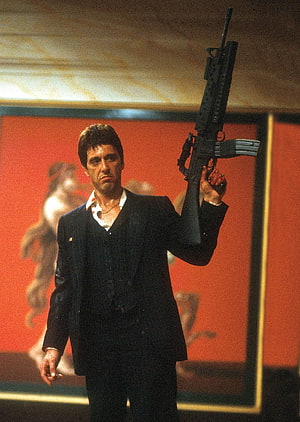 Scarface Movie Still of Tony Montana in Black Suit Holding M60 Machine Gun HD phone wallpaper